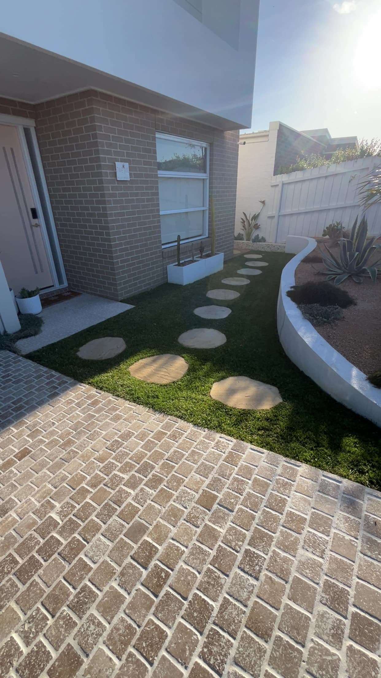 Stepping stones set into fresh turf by KO. Landscapes